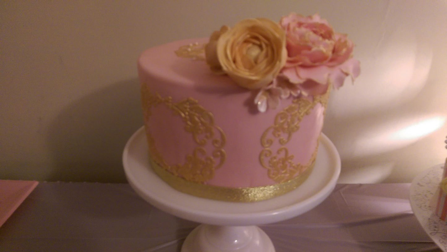Pink fondant cake with sugar flowers
