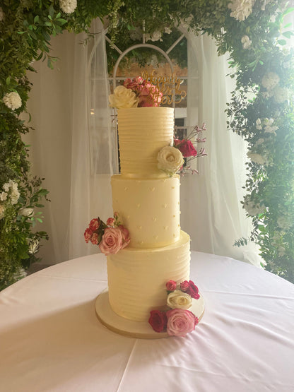 Three-tier buttercream wedding cake