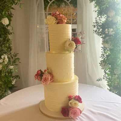 Three-tier buttercream wedding cake