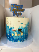 Blue ombré, cream and gold cake