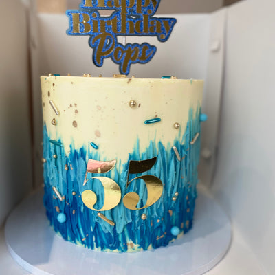 Blue ombré, cream and gold cake