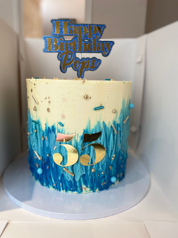 Blue ombré, cream and gold cake