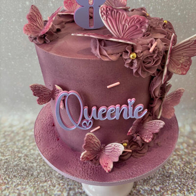 Elegant buttercream cake with butterflies.