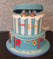 Peek-a-boo and clothes-line baby shower cake