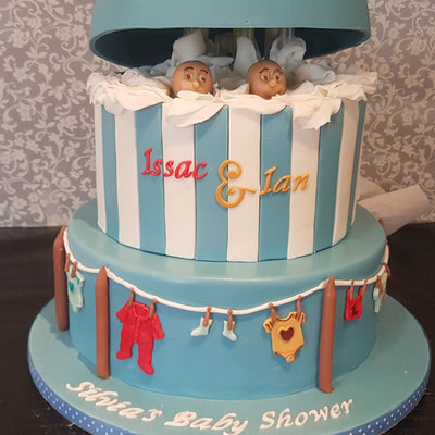 Peek-a-boo and clothes-line baby shower cake