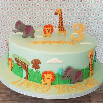 Jungle animals themed birthday cake