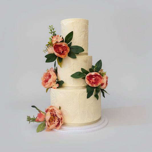 3-tier rustic wedding cake with peach flowers