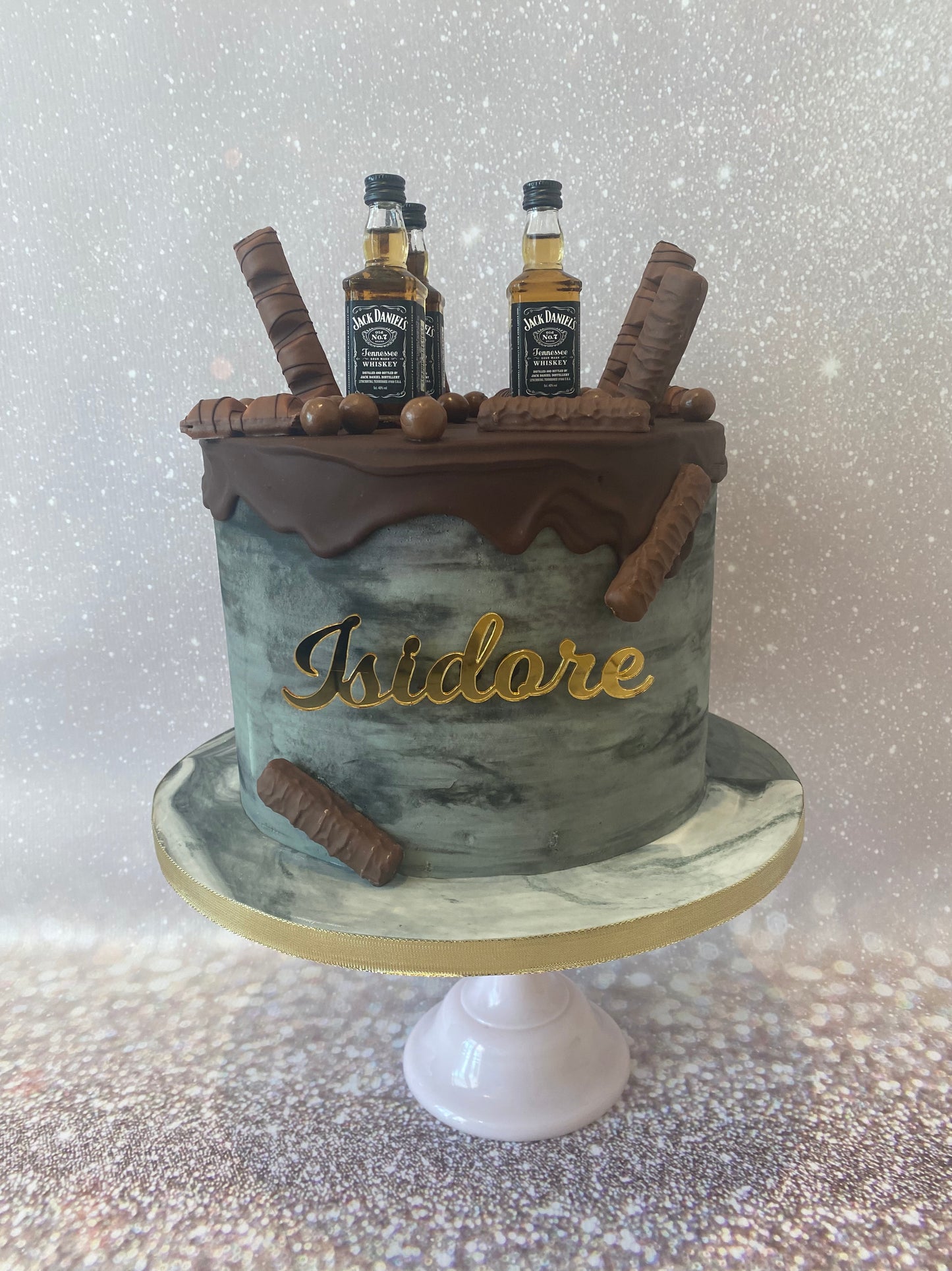 Grey marble effect buttercream with miniature liquor.