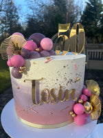Cream, pink and purple ombre cake