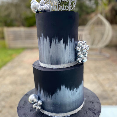 Black cake with silver accents