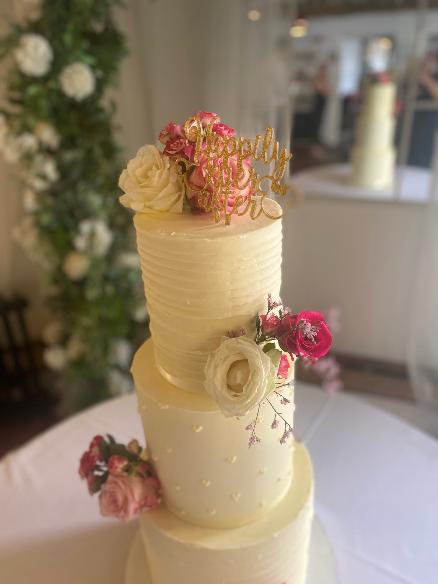 Three-tier buttercream wedding cake