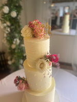 Three-tier buttercream wedding cake