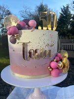 Cream, pink and purple ombre cake