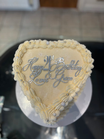 Heart-shaped cake with edible photos