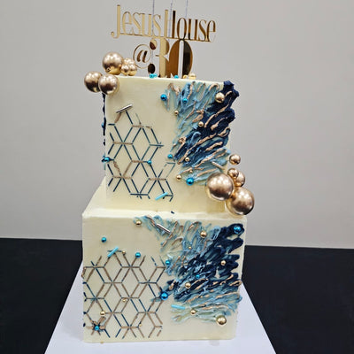 Blue square 2-tier buttercream cake with abstract design