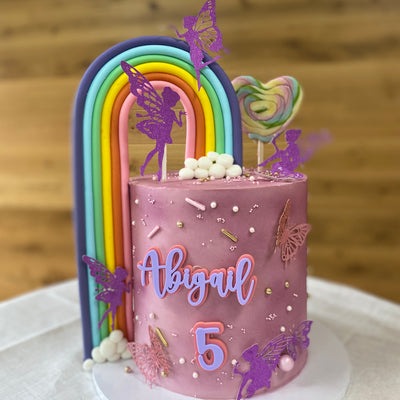 Butterflies, fairies and rainbow buttercream cake
