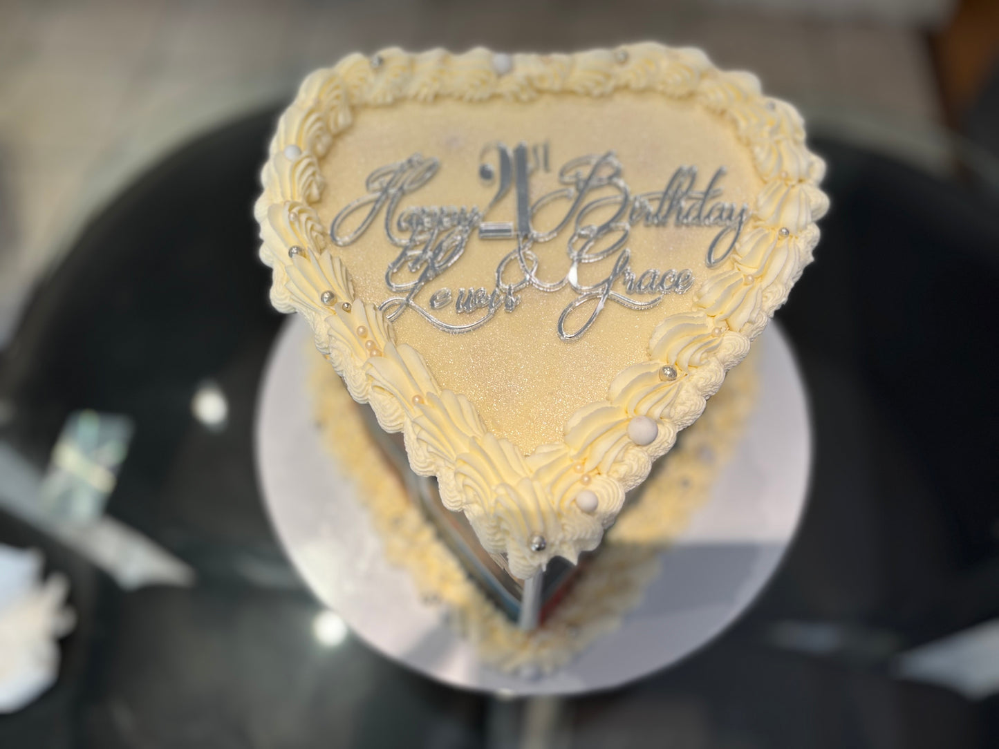 Heart-shaped cake with edible photos