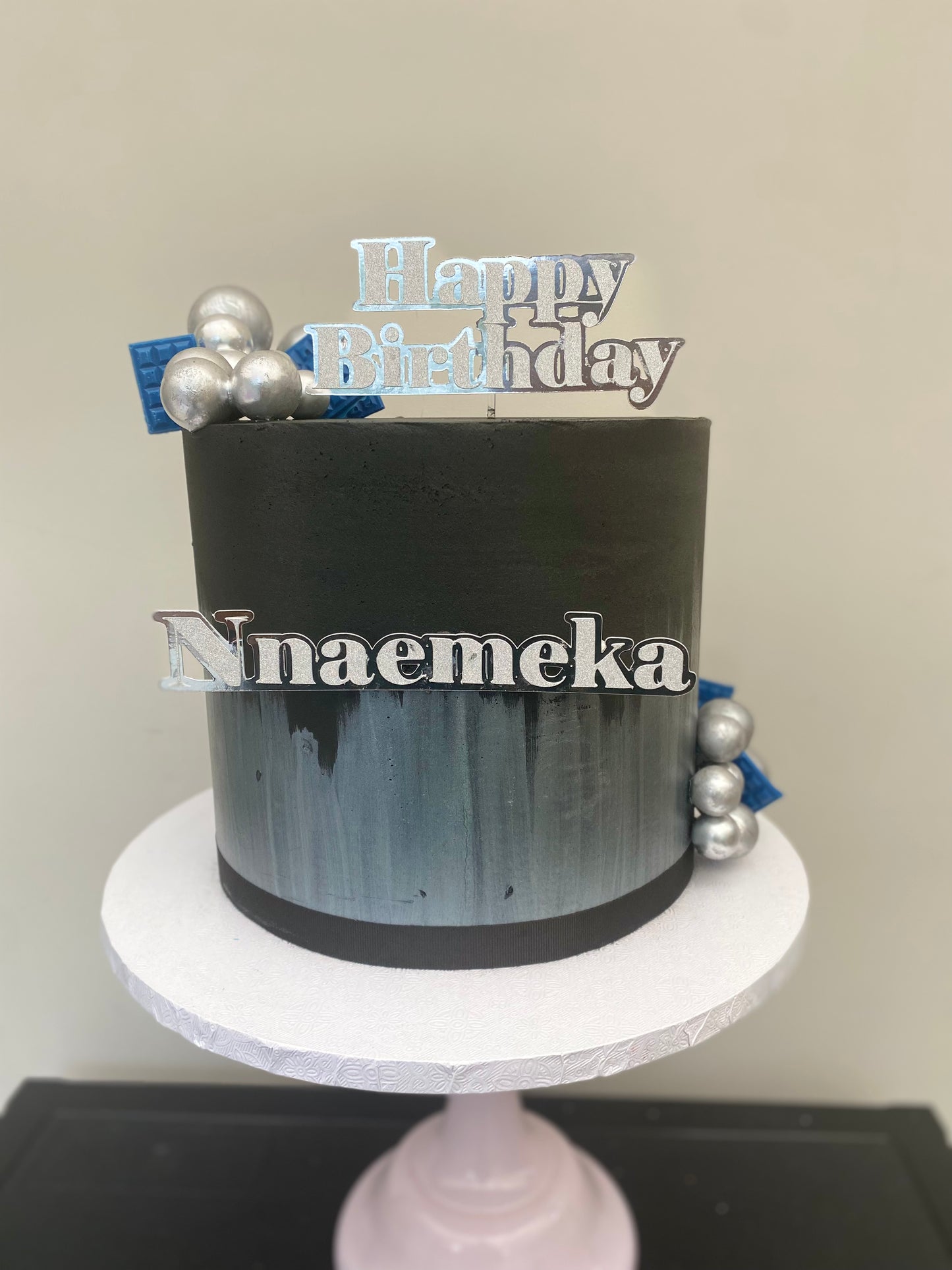 Black and silver buttercream cake