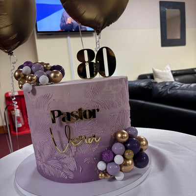 Purple ombre with decorative balls.