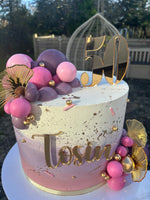 Cream, pink and purple ombre cake