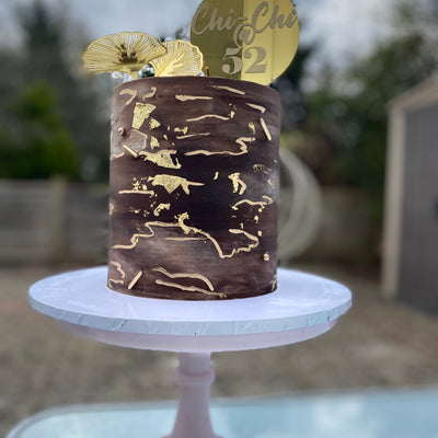 Chocolate brown and gold marble effect buttercream cake