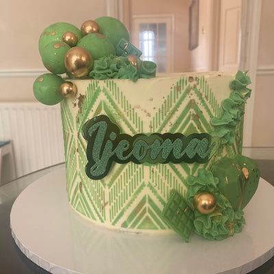 Cream cake with green stencil