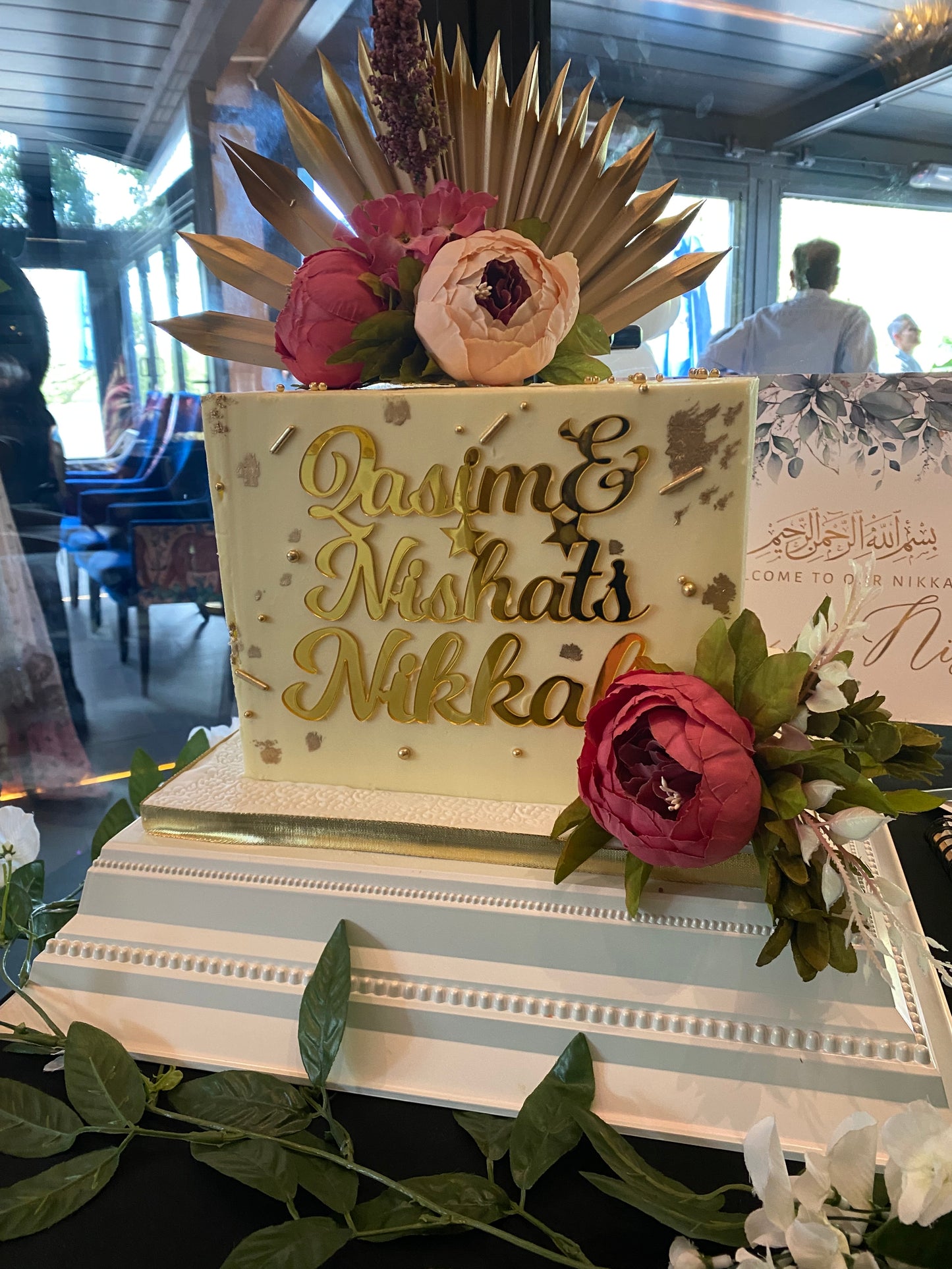 Square buttercream cake with name charm and flowers