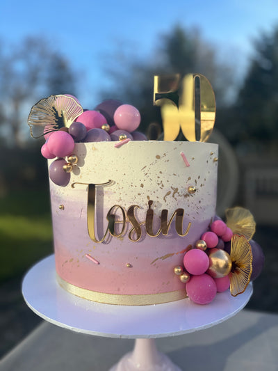 Cream, pink and purple ombre cake
