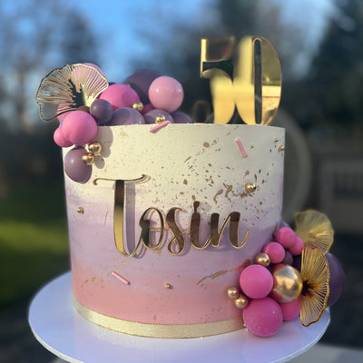 Cream, pink and purple ombre cake
