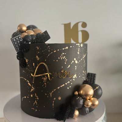 Black and gold splash cake