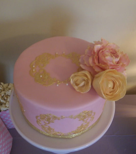Pink fondant cake with sugar flowers