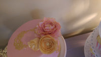 Pink fondant cake with sugar flowers