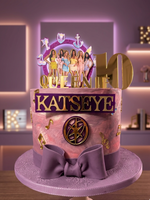 Decorative cake with 'Katseye' and 'Queen' text, featuring a bow and colorful design.