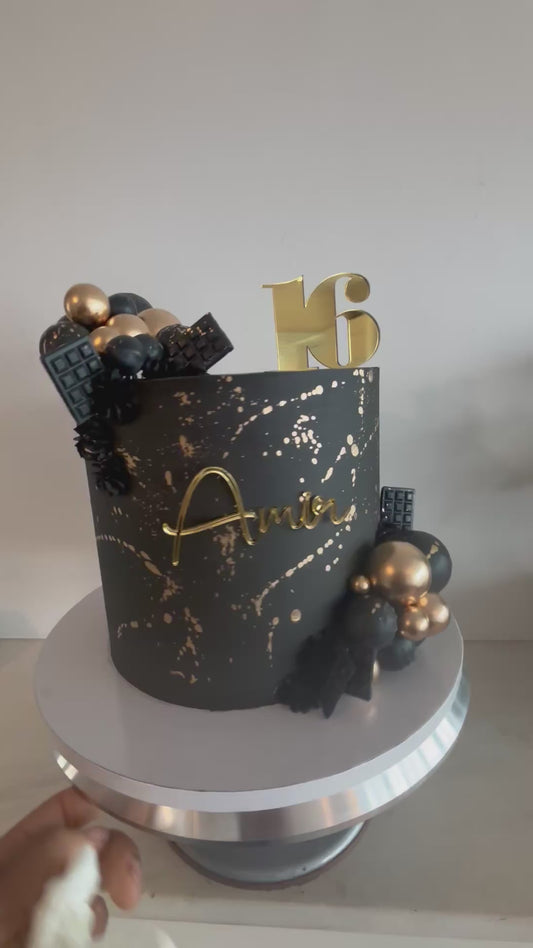 Black and gold splash cake